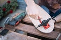 Male hand assembling skateboard trucks with screwdriver Royalty Free Stock Photo