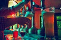 Male hand, bartender pouring foamy lager beer from tap into glass. Bar,, pub worker serving beer mug to customer Royalty Free Stock Photo