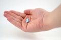 Male hand with blue pills Royalty Free Stock Photo