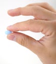 Male hand with blue pills Royalty Free Stock Photo