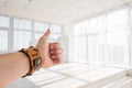 Male hand showing thumbs up sign against white background Royalty Free Stock Photo