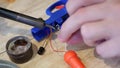 Male hand closeup solder 2 wires . Repair of electrical appliances, soldering tin