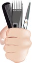 Male hand clutching barber equipment-