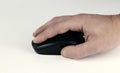 Male hand on computer mouse, close-up on white background Royalty Free Stock Photo