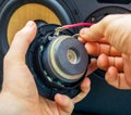 Male hand connecting speaker. Royalty Free Stock Photo