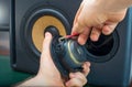 Male hand connecting speaker. Royalty Free Stock Photo