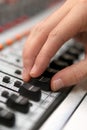 Male hand on control Fader on console. Sound recording studio mixing desk with engineer or music producer. Royalty Free Stock Photo