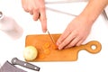 Male hand cutting onions and carrot Royalty Free Stock Photo
