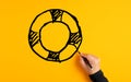 Male hand drawing a lifesaver or lifebuoy sketch on yellow background. Insurance, safety, assistance or aid in business Royalty Free Stock Photo