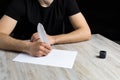 Male hand with a goose feather. Poetry and journalism symbol. The concept of writing texts Royalty Free Stock Photo