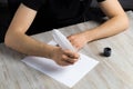 Male hand with a goose feather. Poetry and journalism symbol. The concept of writing texts Royalty Free Stock Photo