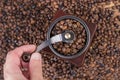 Timeless Ritual: Grinding Coffee Beans in a Retro Coffee Mill - Retro and Vintage Food and Drink Concept Royalty Free Stock Photo