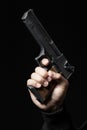 Male hand with gun isolated on black Royalty Free Stock Photo