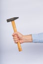 Male hand with hammer on white background. Claw hammer Side view Royalty Free Stock Photo