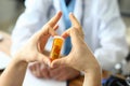 Male hand hold yellow pill jar in hospital doctor office. Royalty Free Stock Photo