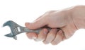 Male hand holding the adjustable spanner isolated Royalty Free Stock Photo