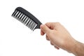 Male Hand Holding A Black Hair Comb Royalty Free Stock Photo