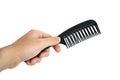 Male Hand Holding A Black Hair Comb Royalty Free Stock Photo