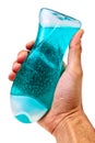 Male hand holding bottle with blue shower gel. Royalty Free Stock Photo