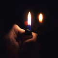 Male hand holding a burning lighter Royalty Free Stock Photo