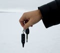 Male hand holding car key and alarm system charm Royalty Free Stock Photo