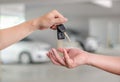Male hand holding a car key and handing Royalty Free Stock Photo