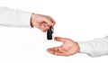 Male hand holding a car key and handing it over to another person Royalty Free Stock Photo