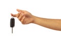 Hand holding a car key isolated on white background, clipping path Royalty Free Stock Photo
