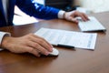 Male hand holding computer mouse with laptop Royalty Free Stock Photo