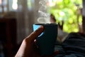 Serene Morning Bliss: Man Enjoying a Cup of Coffee in Bed on a Sunny Summer Day