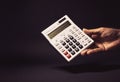 Male Hand Holding a Electronic Calculator Royalty Free Stock Photo