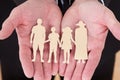 Male Hand Holding Family Cutout Shape Royalty Free Stock Photo