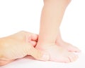 Male hand holding firmly around a foot of toddler Royalty Free Stock Photo