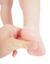 Male hand holding firmly pressing with thumb under foot Royalty Free Stock Photo