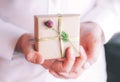 Male hand holding gift box. Royalty Free Stock Photo