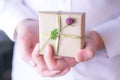 Male hand holding gift box. Royalty Free Stock Photo