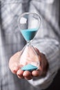 Male Hand Holding Hourglass Royalty Free Stock Photo