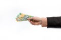 Male hand holding and offering austraian dollar banknotes