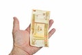 Male hand holding one Cuban Pesos bill isolated on white background Royalty Free Stock Photo