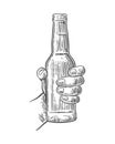 Male hand holding open bottle beer. Black vintage engraving vector