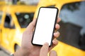 male hand holding phone with isolated screen yellow taxi cars Royalty Free Stock Photo