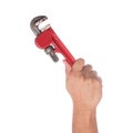 Male hand holding pipe wrench