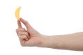 Male hand holding potato chip