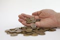 Male hand holding Russian iron coins close up on a white background. Russia crisis. small currency Royalty Free Stock Photo