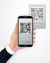 Male hand holding smartphone with QR code scanner mobile app isolated on white background. Cashless payment technology concept. Royalty Free Stock Photo