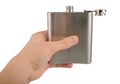 Male hand holding stainless hip flask isolated on white background Royalty Free Stock Photo