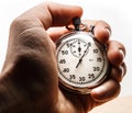 Male hand holding stopwatch Royalty Free Stock Photo