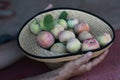 Straw hat with red juicy apples