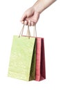 Male hand holding two shopping bags isolated on white Royalty Free Stock Photo