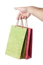 Male hand holding two shopping bags isolated on white Royalty Free Stock Photo